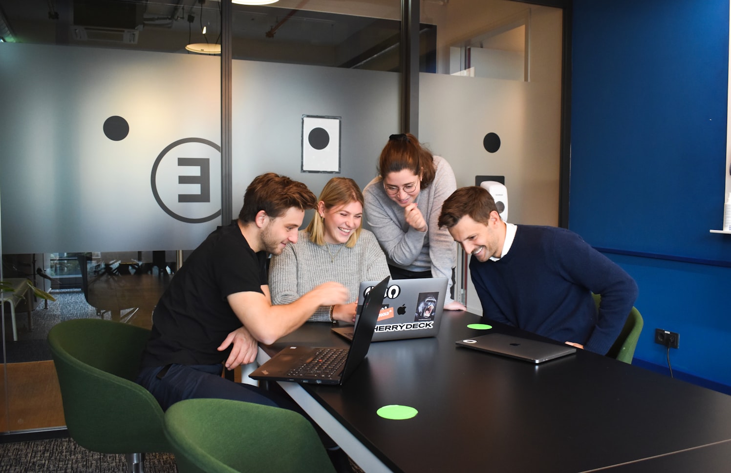 The Argist team working together on laptops